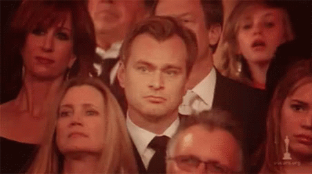 christopher-nolan-listening.gif