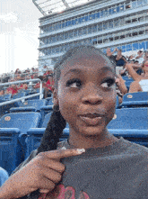stan-twitter-girl-biting-finger-at-football-game.gif