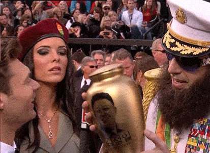 sacha-baron-cohen-ryan-seacrest.gif
