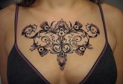 feminine-floral-tattoo-vine-flower-stylized-curls-swirls-pretty-design-for-gilrs-women-chest-cleavage-tat.jpg