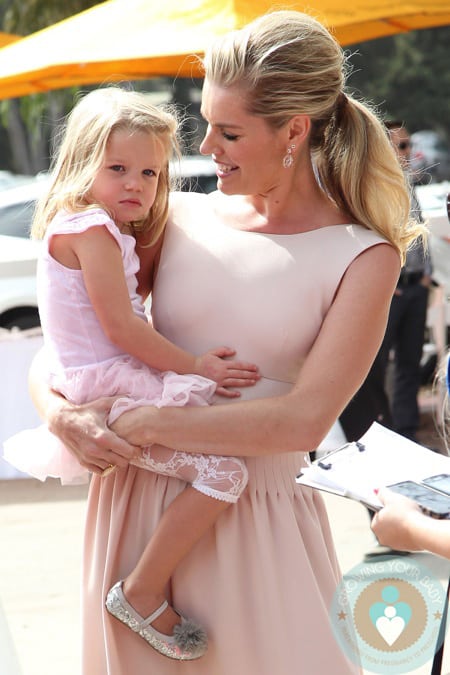 Rebecca-Romijn-with-her-daughter-at-the-Veuve-Clicquot-Polo-Classic.jpg