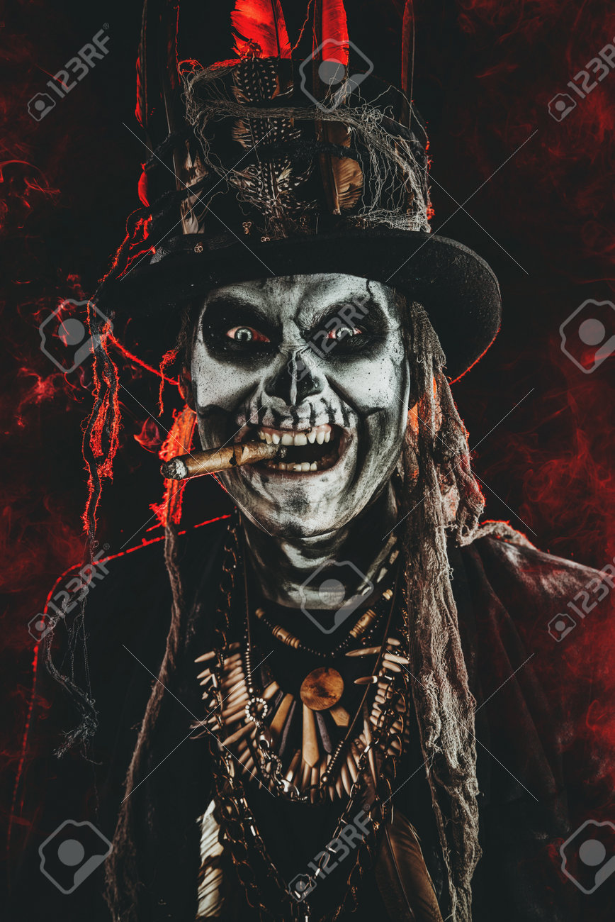 86130691-baron-saturday-baron-samedi-a-man-with-a-skull-makeup-dressed-in-a-tail-coat-and-a-top-hat-dia-de-lo.jpg