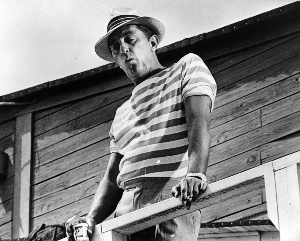 cape-fear-1961-001-mitchum-in-stripy-t-shirt-with-bear-on-verandah-00m-r0y.jpg